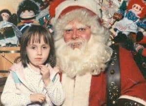 weird santa photo with little girl and creepy santa