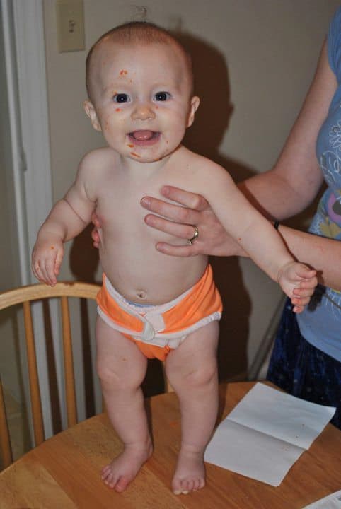 smiling baby in cloth diaper