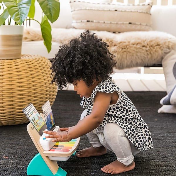 toddler playing Baby Einstein Magic Touch Piano