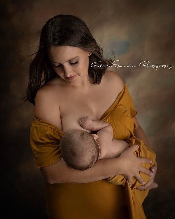 woman breastfeeding her baby