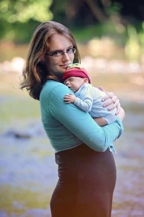 Preemie held by mother for portrait