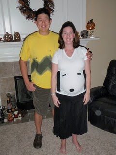 Husband dressed as Charlie Brown with pregnant Snoopy wife