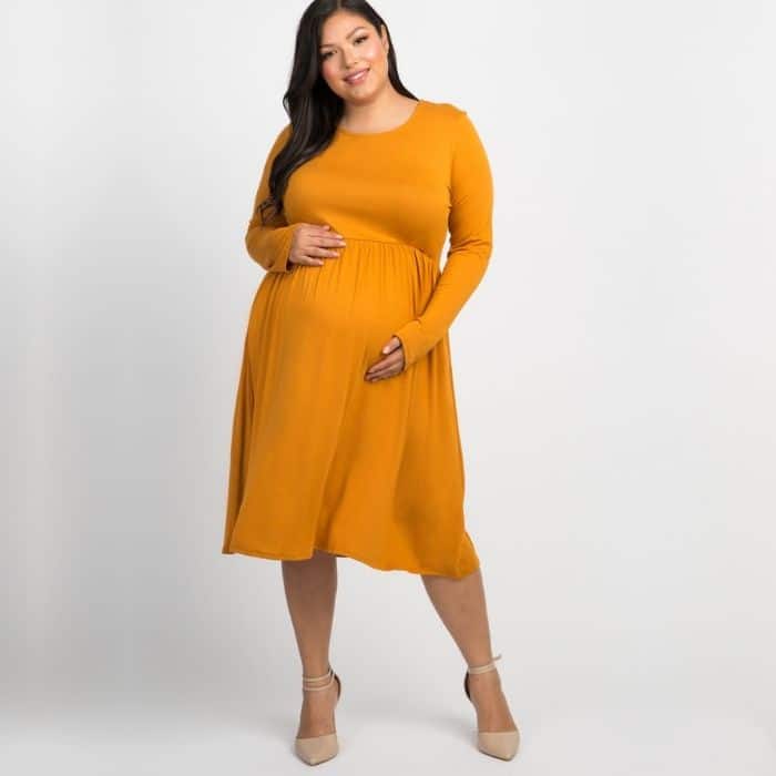woman wearing plus sized maternity dress