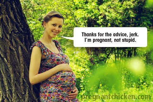Pregnant woman holding belly - pregnancy side effectsPregnant woman holding belly - pregnancy side effects