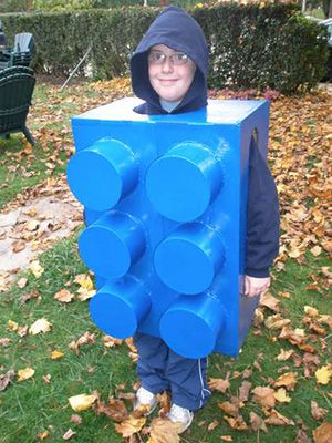 Boy dressed up as blue lego piece