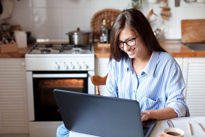 woman working on laptop in her home