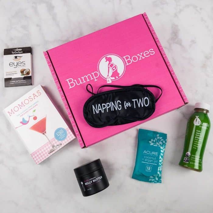 Bump Boxes subscription box showing samples of products, a sleep mask, and a book
