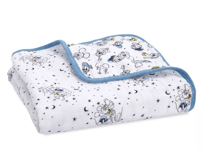 Muslin blanket featuring stars, moons, and Mickey and the gang.