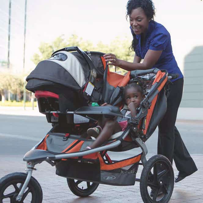 mom and toddler in stroller. The Best Equipment For Juggling More Than One Kid