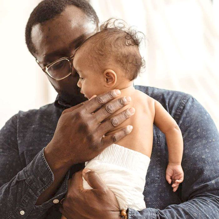 dad holding baby in eco friendly organic diaper