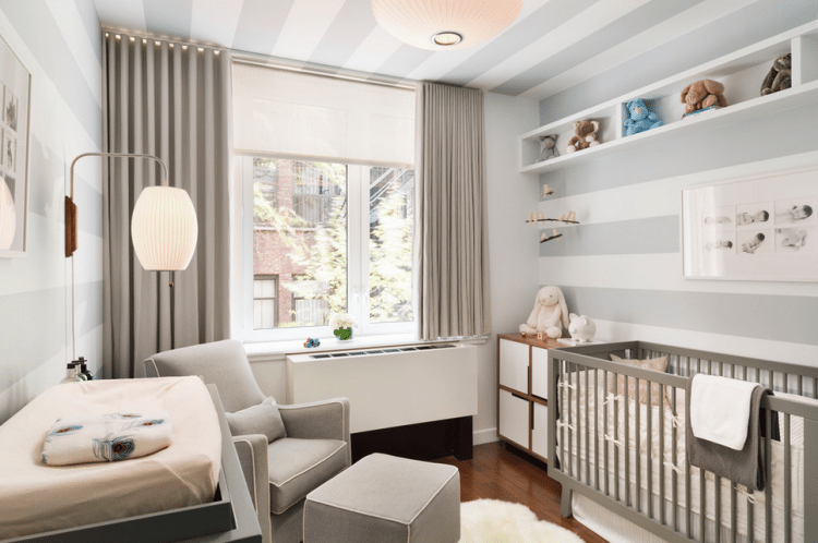 nursery with blackout curtains to help sleep train baby