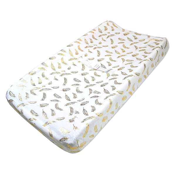 white changing pad with gold feathers