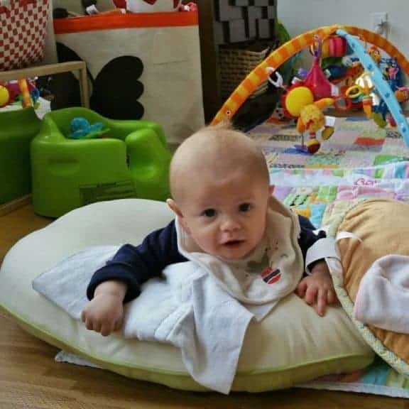 young baby doing tummy time