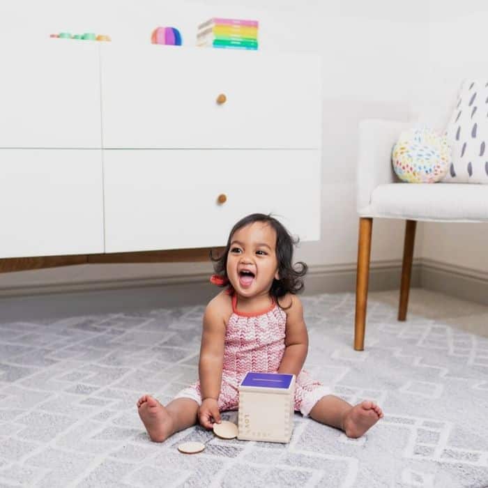 toddler playing with toy from baby subscription box