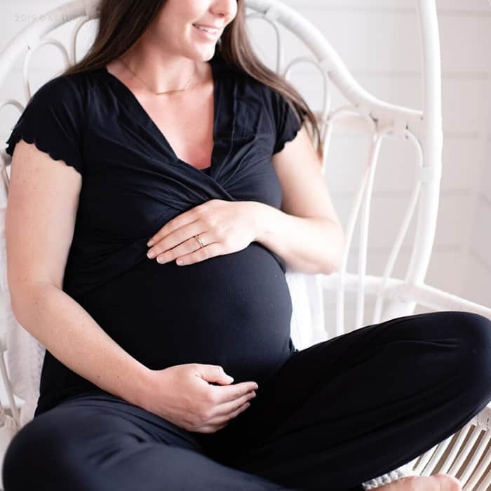 pregnant woman in pjs she got as a baby shower gift