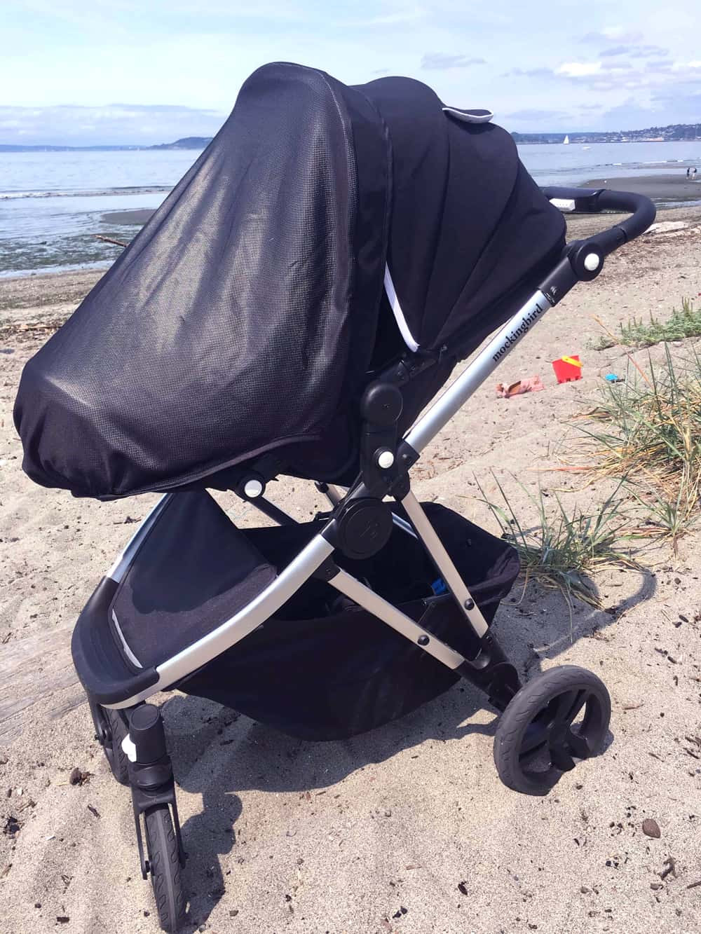 Stroller with sunshade on the beach