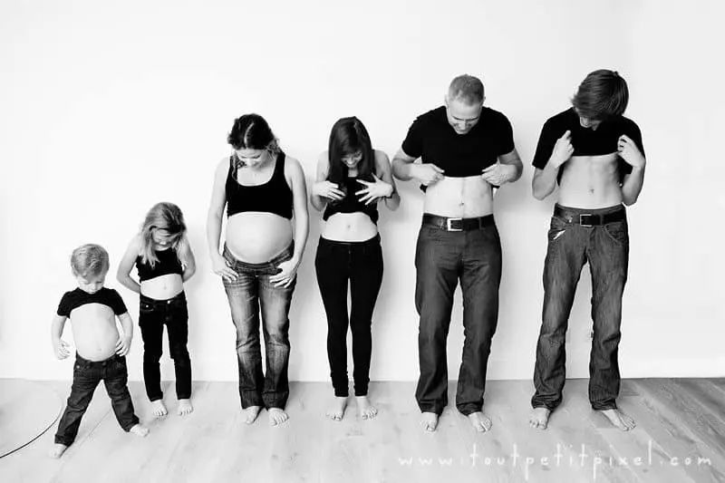 photo of family looking at their bellies