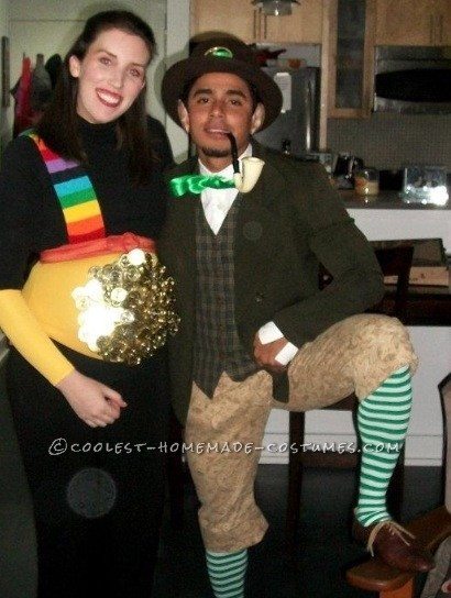 pregnant woman dressed as a pot of gold with her leprechaun husband