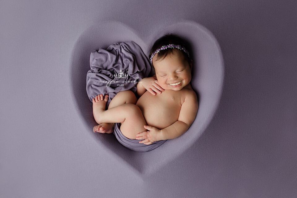 newborn baby with teeth photoshopped in.