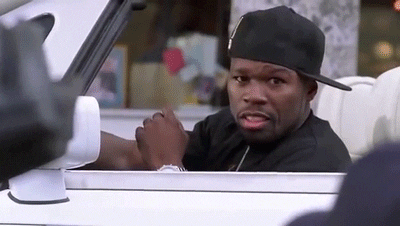 Gif of 50 Cent smiling at camera and driving away