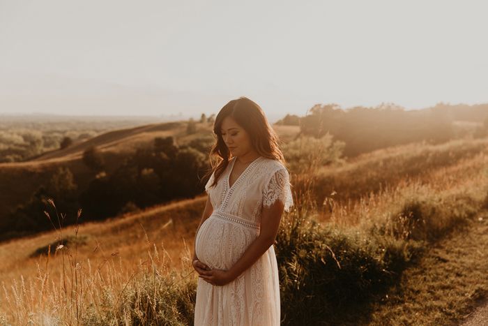 pregnant woman at sunset