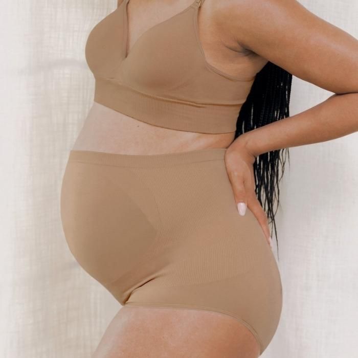 pregnant person wearing nude high rise maternity briefs