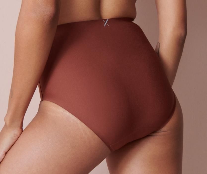 woman wearing wine colored resuable underpants