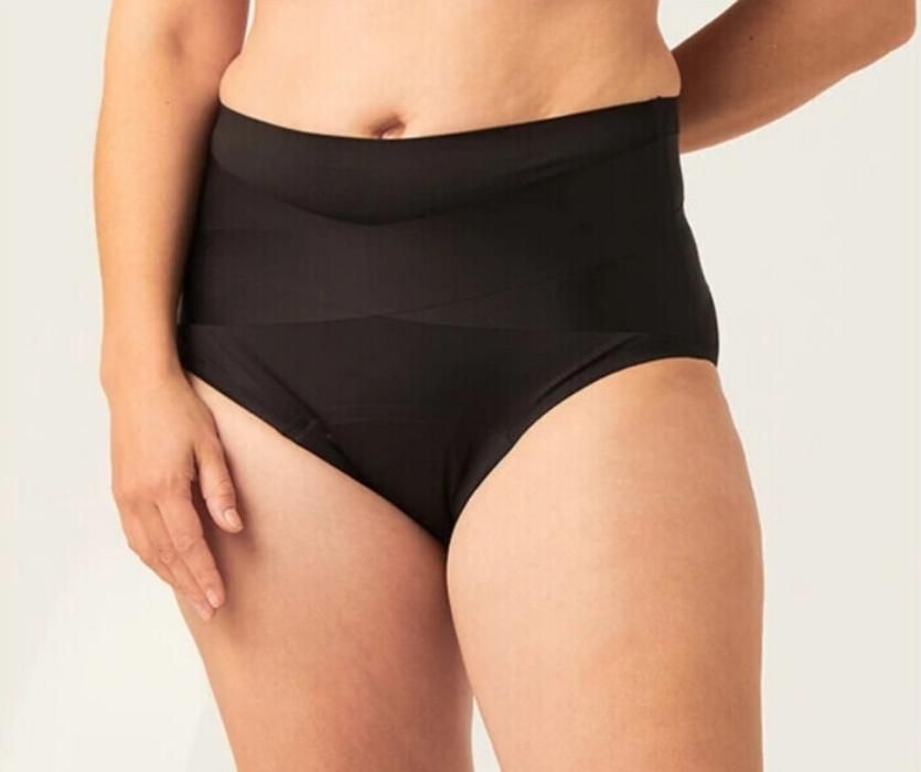 woman wearing black reusable underwear after giving birth