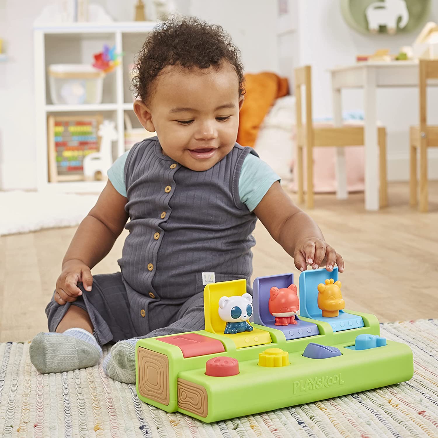 baby playing with poppin pals stem toy
