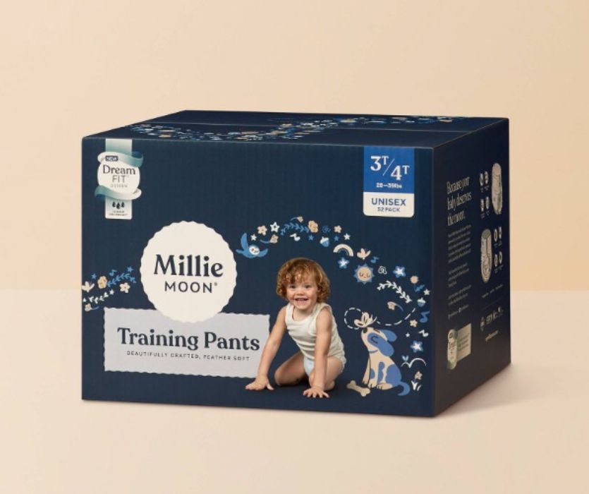 Box of blue Millie Moon training pants on beige background