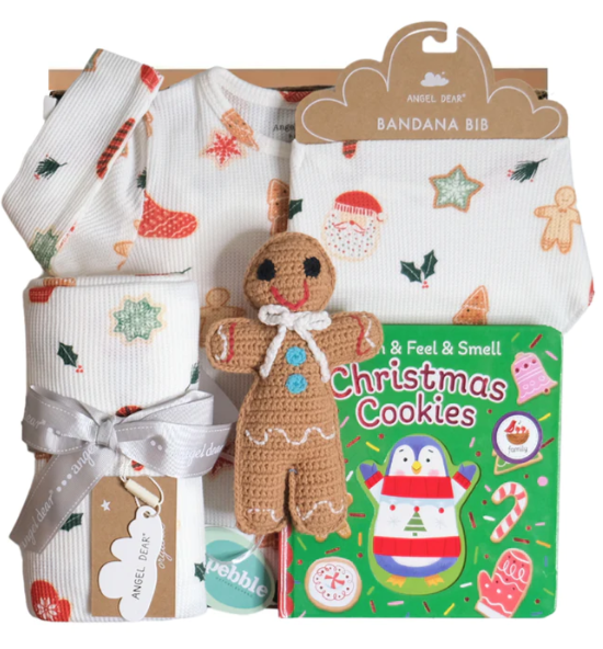 gingerbread toy with chistmas cookie book and holiday pj gift box