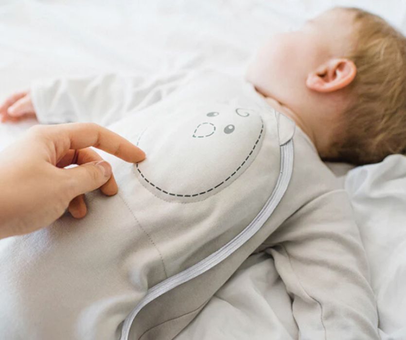 baby sleeping with weighted sleep sack