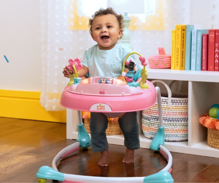 baby in pink and blue baby walker