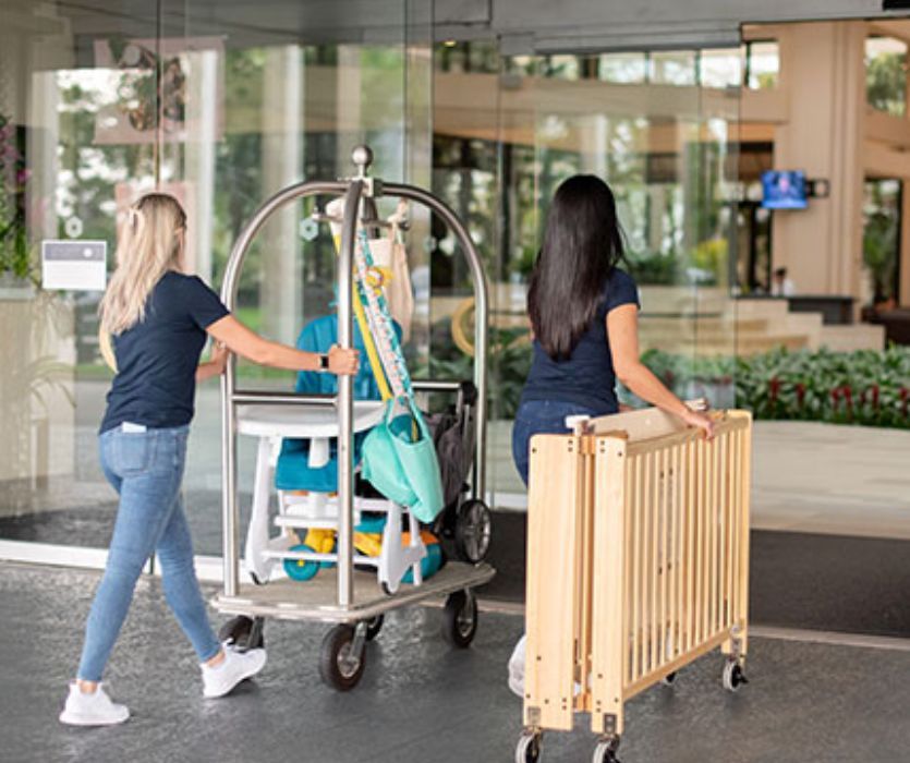 team from baby quip delivering baby gear to a hotel