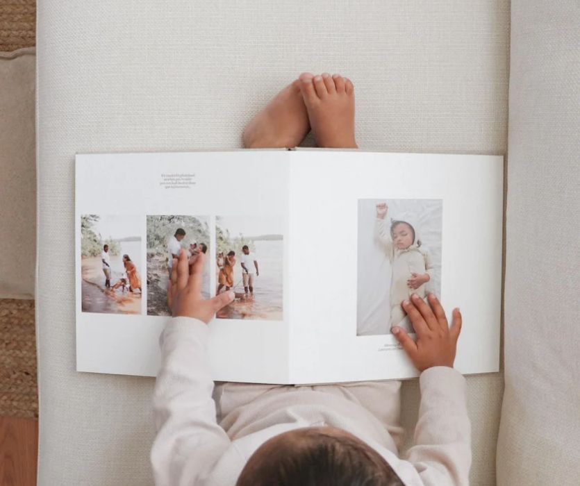 child looking at professionally designed photobook