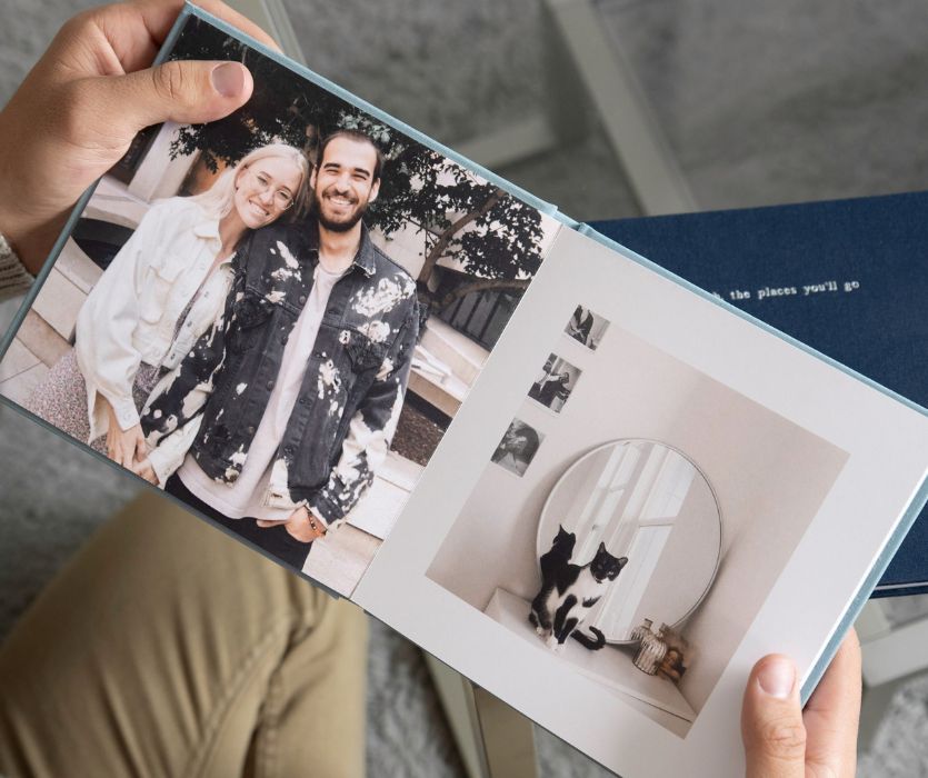 man holding a custom photobook