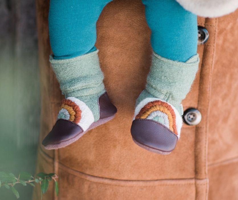 baby feet wearing nook design shoes