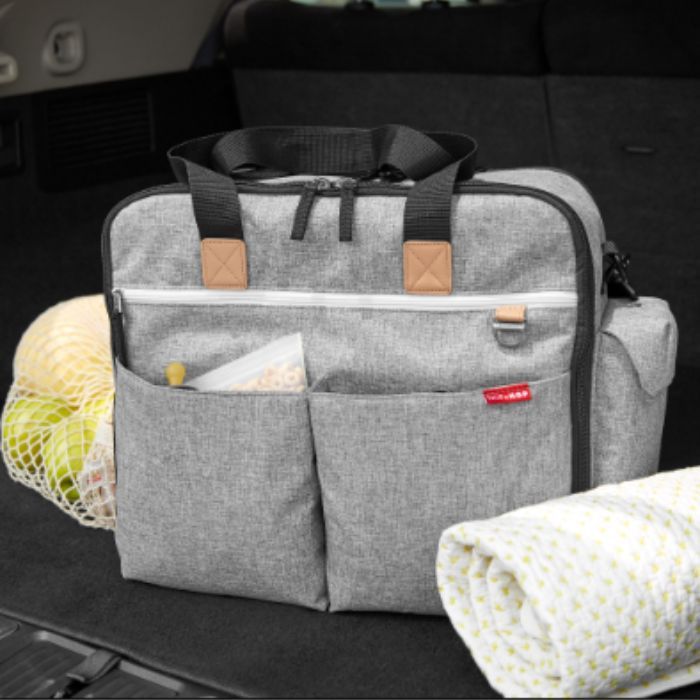 Duo Weekender Diaper Bag in the trunk of a car