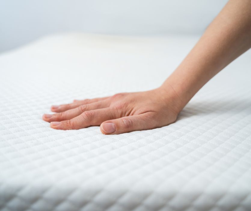 hand on mattress