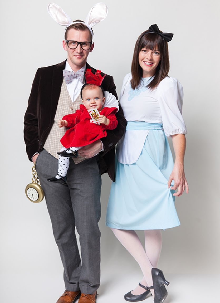parents and baby dressed up in alice in wonderland costumes