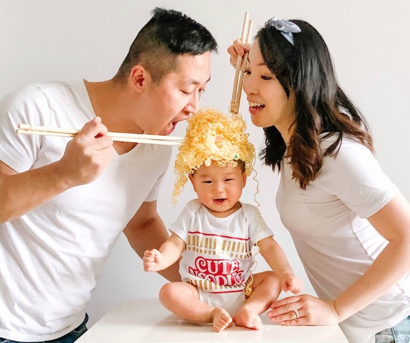 baby wearing diy ramen noodle costume with parents