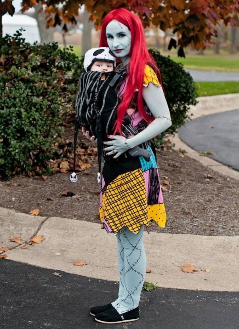 mom with baby in a carrier dressed as Sally and Jack Skellington for halloween