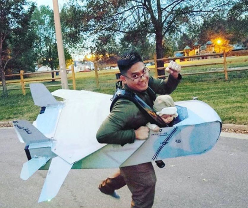 dad baby wearing dressed in top gun costume