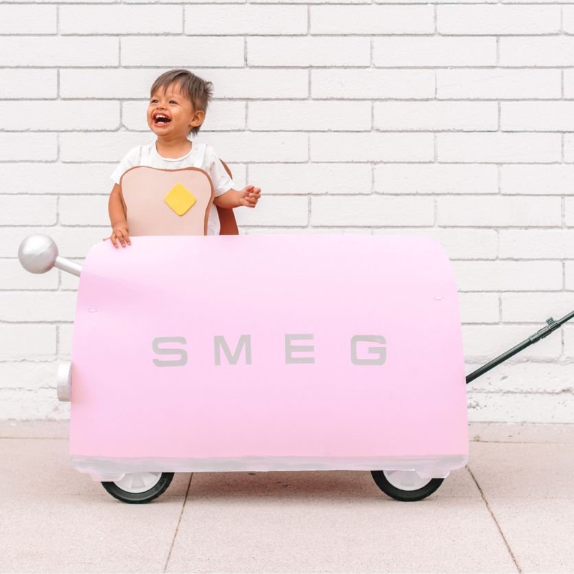 kid wearing a piece of toast in a Smeg toaster wagon costume