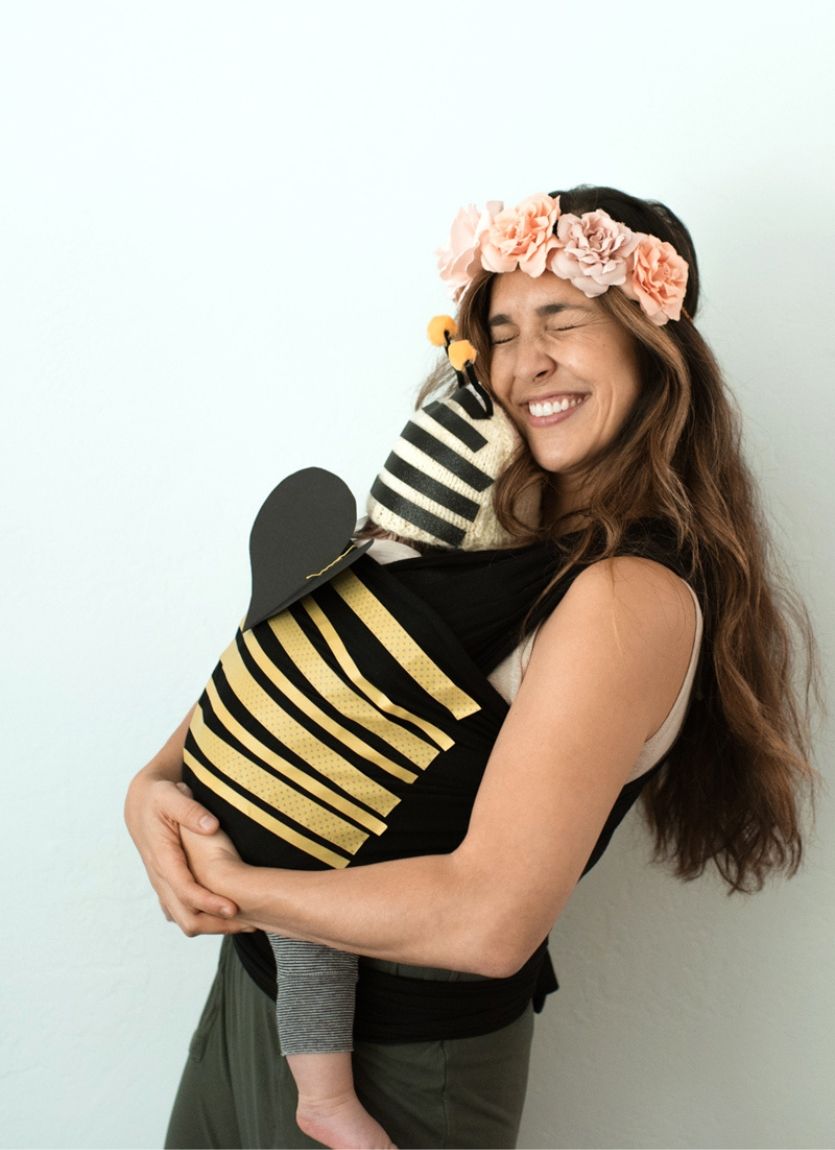 baby carrier made to look like a bee with mom dressed up as a flower for halloween