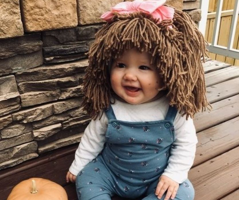 baby dressed up as a cabbage patch kid for halloween