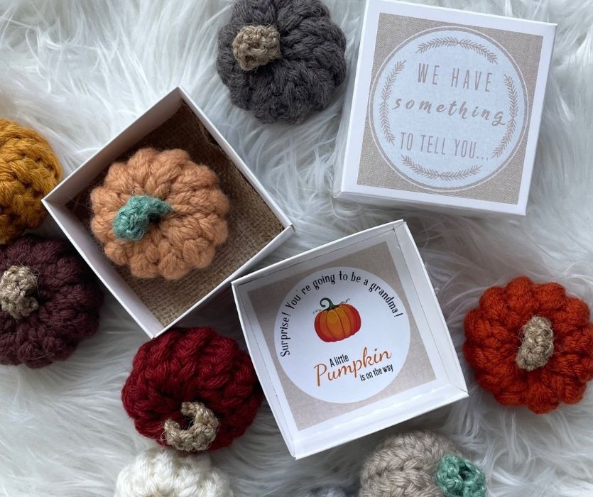 crocheted pumpkins in a small pumpking on the way box