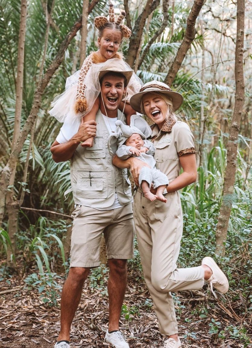 family with toddler and baby wearing jungle themed costumes