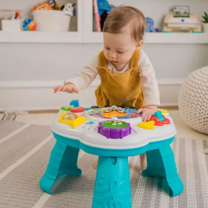 baby playing with Baby Einstein 2-in-1 Discovering Music Activity Table and Floor Toy