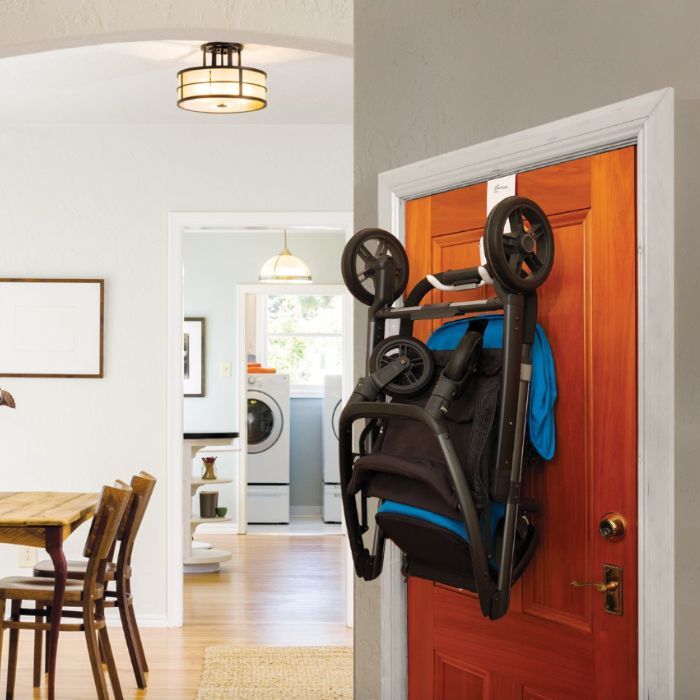 stroller hung on the door in an apartment